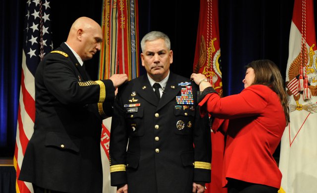 GEN Ray Odierno, Army Chief of Staff, and Ann Campbell, pin the 4th star on General John Campbell's shoulder boards at a Pentagon ceremony on March 8, 2013.  He is the 34th Deputy Chief of Staff of the US Army.  (U.S. Army photo.)