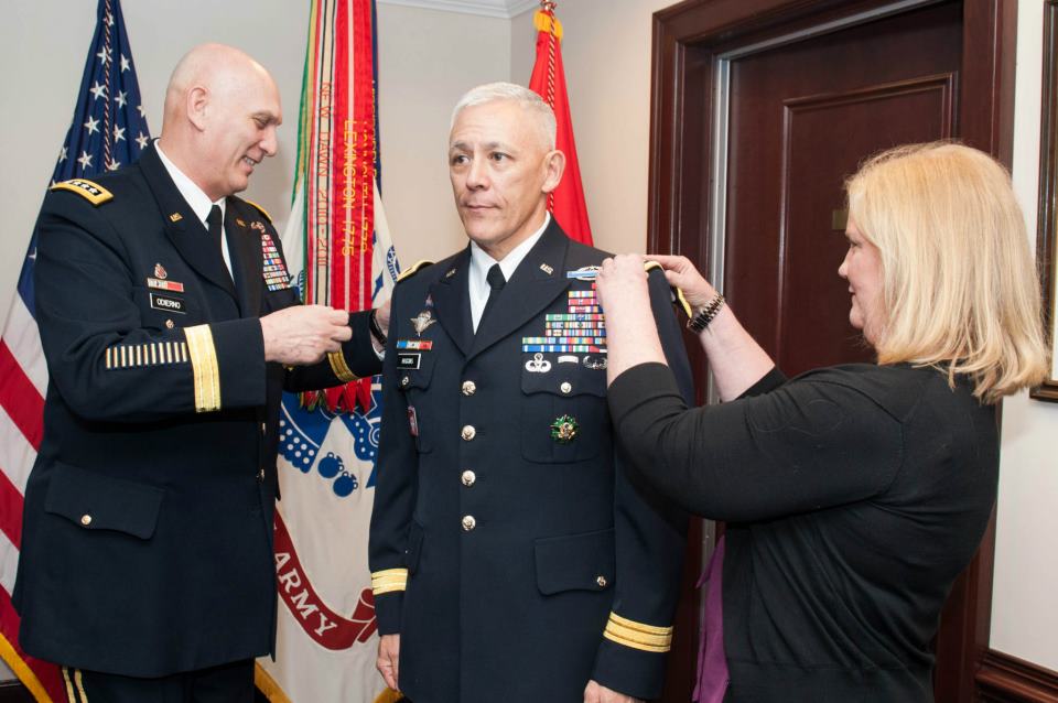 Melissa Huggins helps U.S. Army Chief of Staff Gen. Ray Odierno pin her husband Maj. Gen. James L. Huggins as he is promoted to Lieutenant General and becomes the new Deputy Chief of Staff, G-3/5/7, Headquarters Department of the Army at the Pentagon, March 8, 2013 . (U.S. Army photo by Staff Sgt. Steve Cortez)