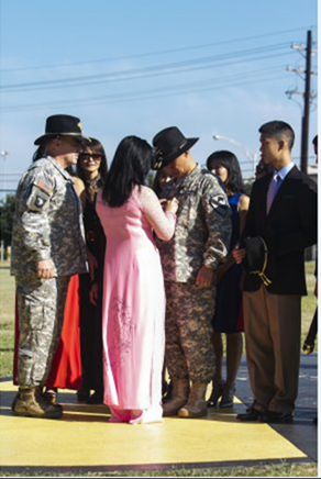 BG Viet Luong, pinning on ceremony.  Left to Right:  LTG Mark 	Milley, Commanding General, III Corps; Minh Albano, sister; Kim (pink), wife; BG Luong; Minh Jacqueline Luong, sister;  Brandon, second child.