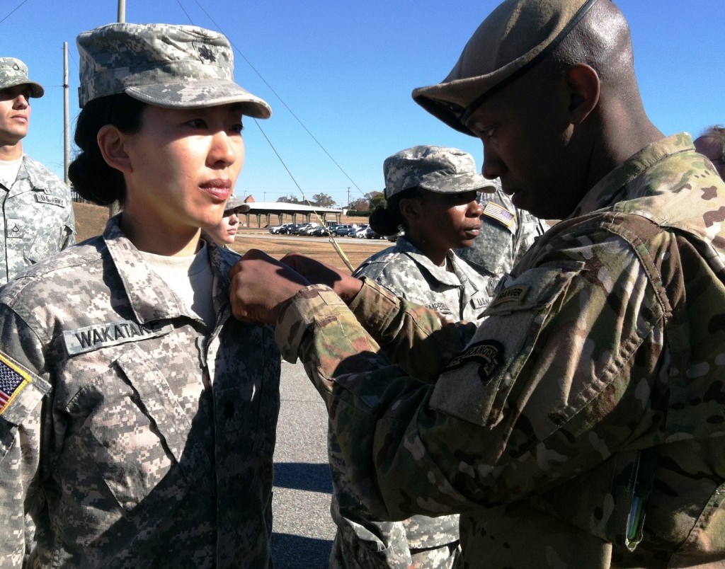 After completing 5 parachute jumps, Lt Col Kay Wakatake had her wings pinned on by Sergeant First Class Raymond Richardson, Senior Paralegal NCO, 75th Ranger Regiment, Fort Benning, GA.  (Photo by Captain Greg Peterson, 75th Ranger Regiment, Fort Benning, GA.)